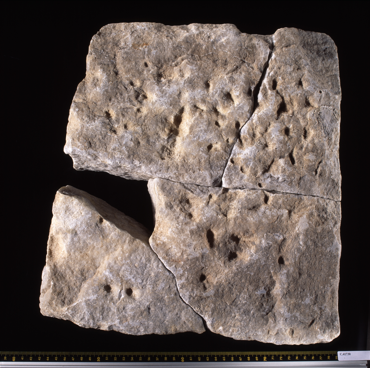 Rectangular stone slab in 4 fragments with Greek inscription;  small, nicely carved letters.