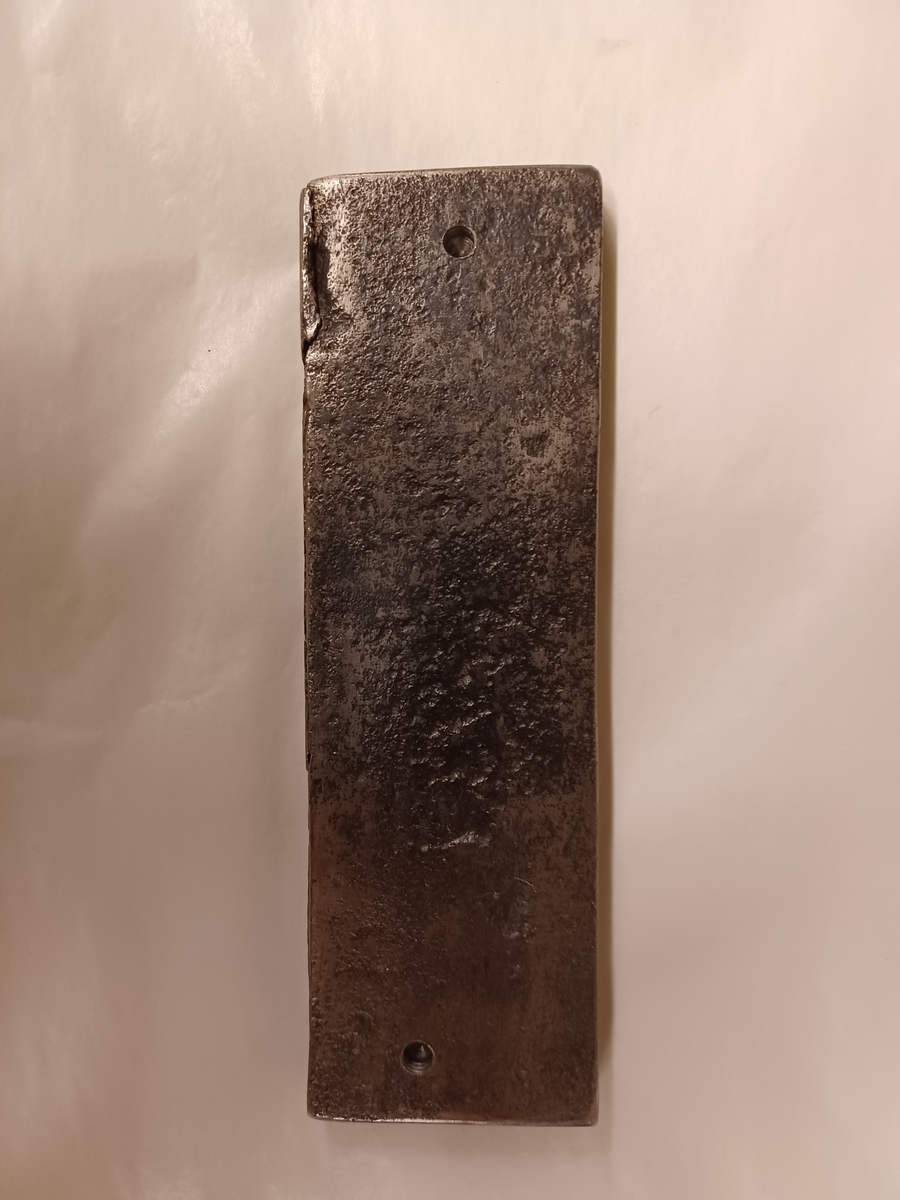 Avtryck av järnstämpel i prov av stångjärn. 