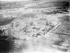 Flygbild av stad med järnväg i Europa, 1910-tal.