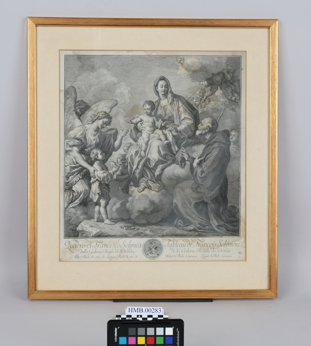 Jomfru Maria med barnet. Maria sitter på en sky midt på bildet med Jesus på fanget. En gammel mann i munkekutte kneler på høyre side. På venstre side fører en engel et barn frem. I bakgrunnen ses putti (dvs. små uskyldige barneengler). Under bildet er der innskrift og våpenskjold