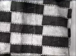 Detalj av textil. Okänd kontext.