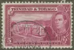 Frimärke ur Gösta Bodmans filatelistiska motivsamling, påbörjad 1950.
Frimärke från Trinidad och Tobago, 1941. Motiv av Generalpostbyggnad och Nationalbank på Trinidad (t.h.) Kung George VI.