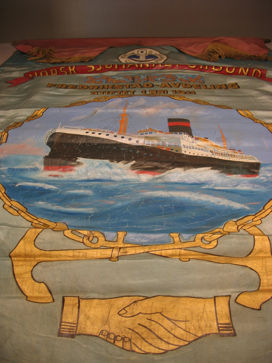 tekst, båt, anker, fyrbøter i arb., ornamenter.