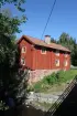 Bostadshuset vid gården Gerlaks, Gavelhyttan, murverk, faluröd panel, lertegel, skorsten.