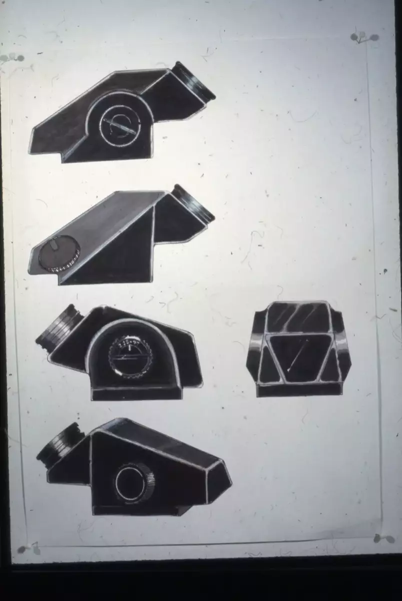 Mätsökare. 

Miljöbilder på skissarbetet, skisser på detaljer och helhetsdesign samt modeller monterade på existerande Hasselbladskamera.