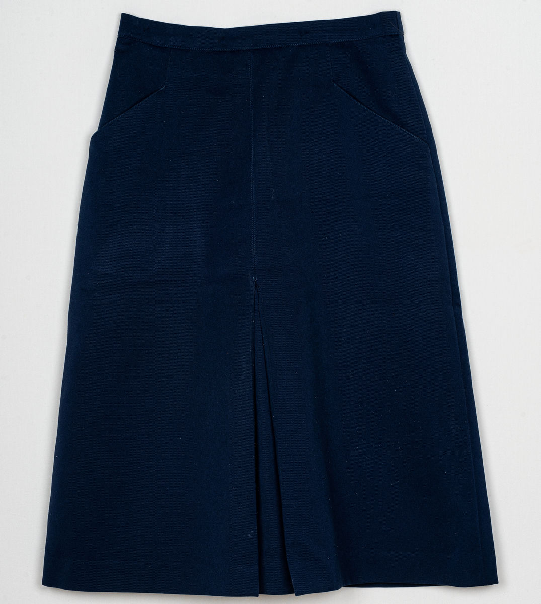 Mörkblå uniformskjol i gabardin.