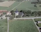 Flygfoto över Stora Skedvi och kyrkan 1967.