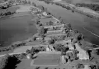 Flygfoto över Tylla, Torsång, Borlänge 1956.