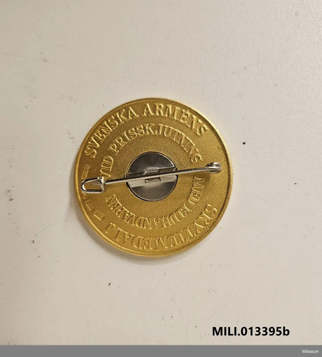 Skyttemedalj i valören guld, tillverkad av förgyllt silver.
