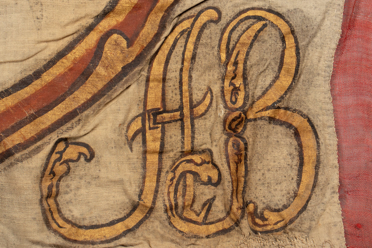 Dannebrog med kong Christian 7. (1749-1808) monogram og krone.