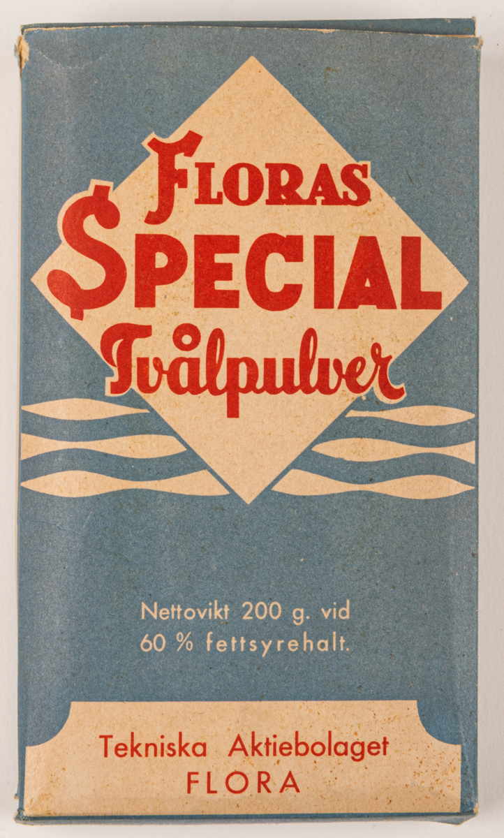 Tvålpulverförpackning, kartongpapp, maskintillverkad. 
Förpackning fylld med tvålfligor från Tekniska AB Flora, Gävle.