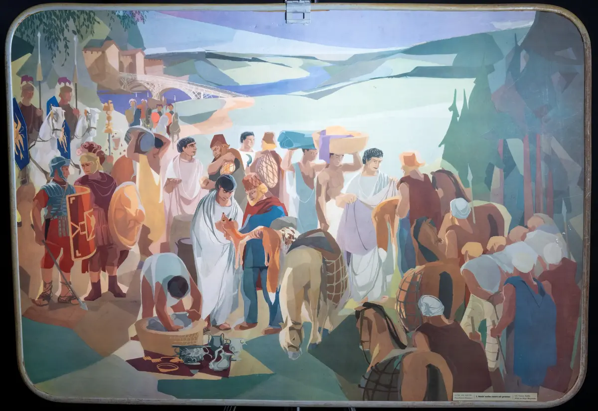 Skolplansch från Solbergaskolan.

Dubbelsidig, på ena sidan "I den medeltida staden", på andra sidan "Handel mellan romare och germaner".