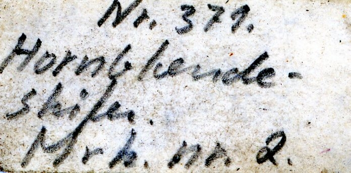 Bergskolens samling
Angitt i "Tillægs-Katalog til Sølvværkets Mineralsamling", Laurits Meinich 1865
under "5 Fahrter ned i Kongens Grube"

Etiketter:
406.
No. 2

406
No. 2
12 Ltr
1.4 mg

Nr. 372
Hornblendeskifer
Mrk. nr. 2

Nr. 371.
Hornblendeskifer
Mrk. nr. 2