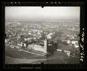 Flygfoto över Stockholm med stadshuset i förgrunden.