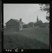 Byggnader, Karesuando kyrka i bakgrunden. Lappland.