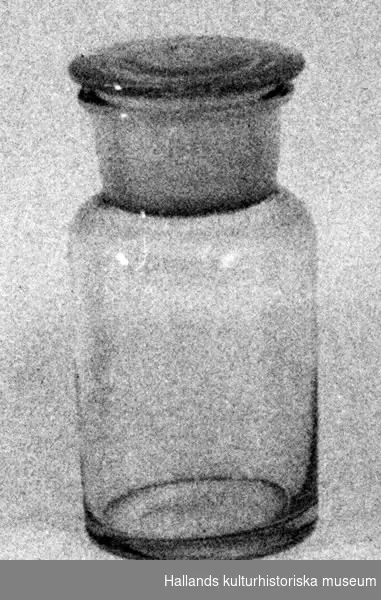 Burk, så kallad apoteksglas. a) Burk. Cylindrisk. b) Glaspropp.