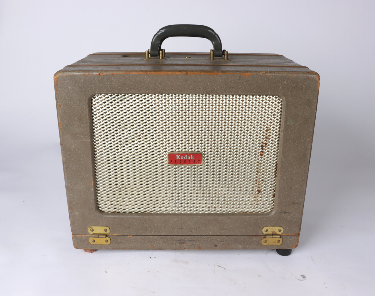 Fremviser/prosjektor fra Kodak bygd inn i en kasse av lakket komposittmateriale. Kassen har låser på hver side slik at den kan åpnes og sidepanelet fjernes. På toppen av kassen er det to hanker for å bære.