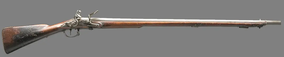 Musköt M/1725. Stämplad pipans översidan: 89,763,P, krönt S,MPS. Stämplad pipans undersidan: Jönköpings krönta ring. Två stämplar oidentifierade. Stämplad varbygeln bakre arm: GSB. Stämplad varbygeln undersida: 763. Stämplad bakplåten: BM. På kolven S.S.C, C, samt ristat N 10, manskapsnummer + ett bomärke. 