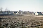 Utsikt från Östrabo (ladugårdsbacken) mot bl a Norrtullskolan och domkyrkan (utan tornspiror). 
Färgfoto ca 1959.