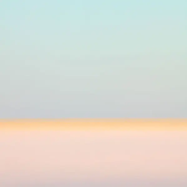 Fotografi av duse farger som går fra blått til oransje. 