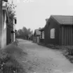 Falun, stuga vid Björngränd. Landinska gården, Sturegatan 76 från söder, med sadeltak över porten 1914.