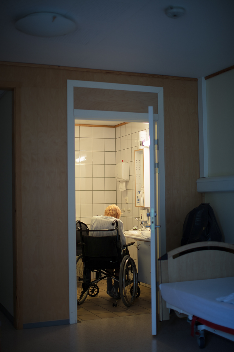 Then and In Between Now #From behind in the wheelchair in the bathroom [C-type print]