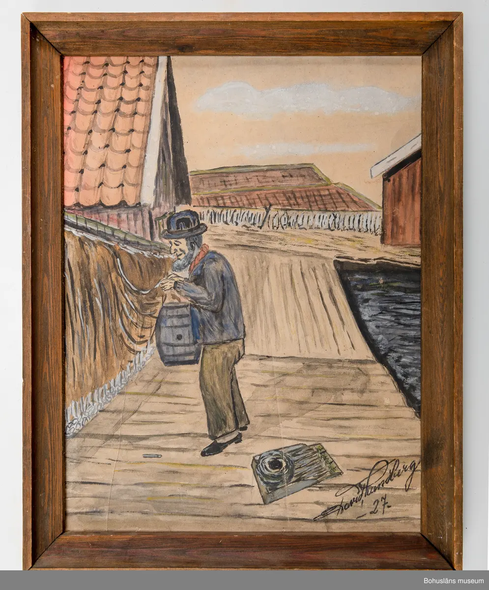 Fiskare vid sjöbodar