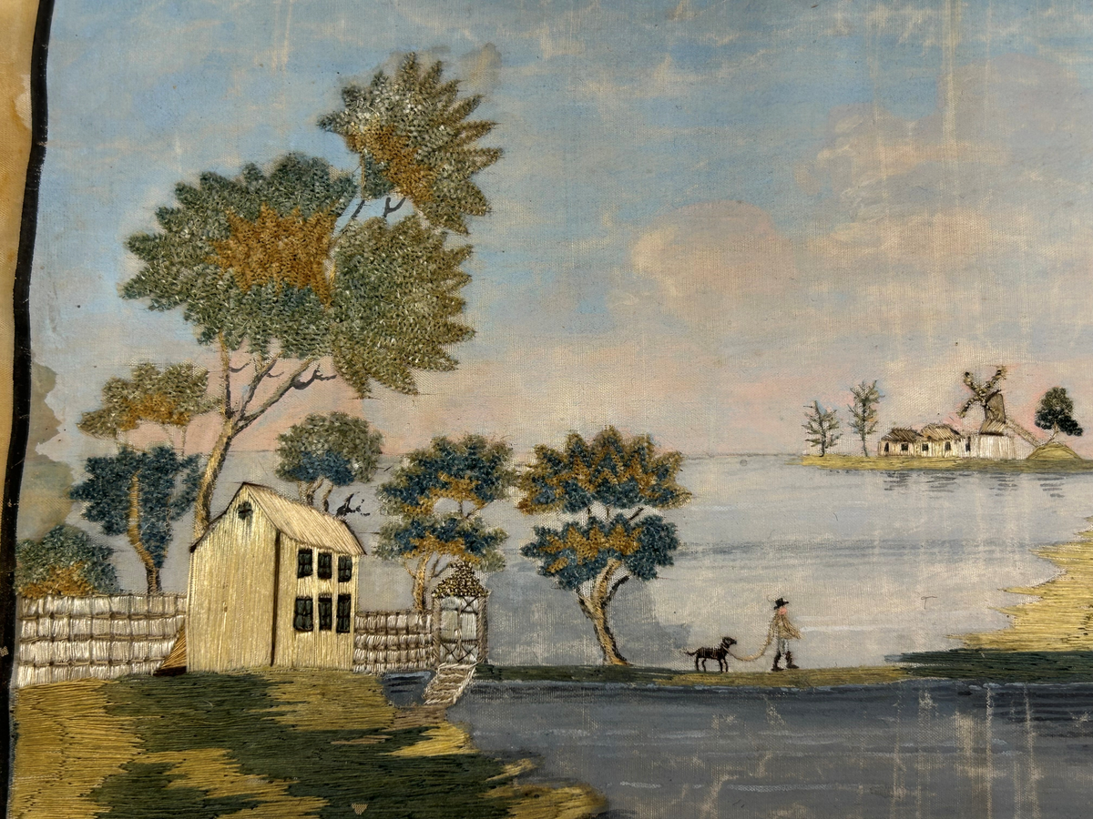 Landskapsmotiv föreställande en strand vid en sjö med till en viss del bebyggda öar.