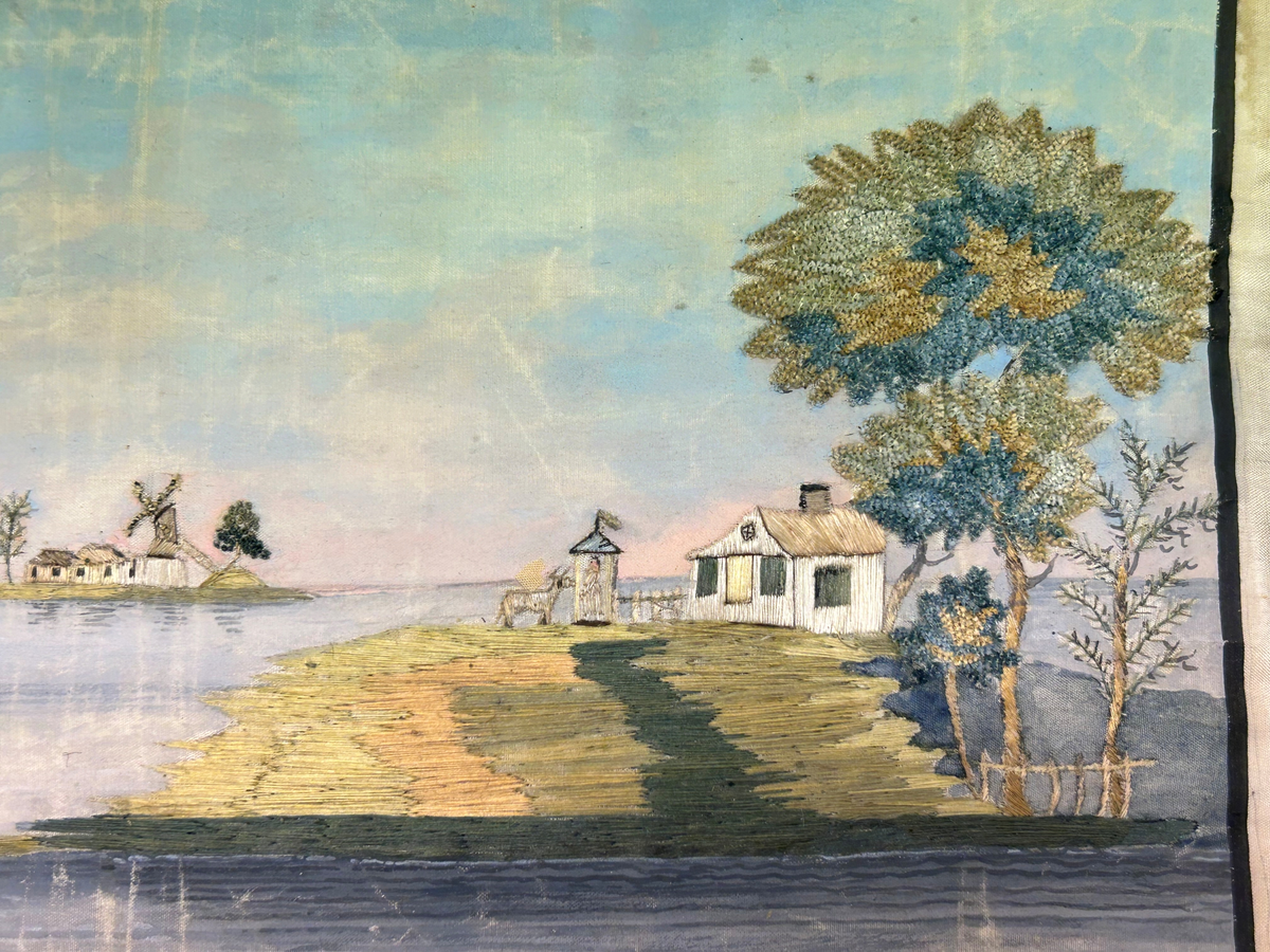 Landskapsmotiv föreställande en strand vid en sjö med till en viss del bebyggda öar.