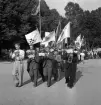 Nykterhetsfolkets dag. Marsch med musikorkester i täten, på väg in på jubileumsutställningens område.