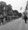 Hantverkets dag. En musikkår m.m. är på väg längs Kronobergsgatan söderut.