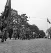 Hantverkets dag. Ett demonstrationståg är på väg längs Kronobergsgatan söderut, i höjd med Sandgärdsgatan. Grodperspektiv.