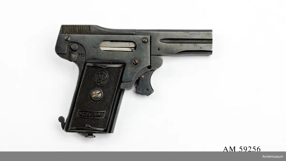 Grupp E III.
Miniatyrpistol. Världens minsta automatpistol, kallad Kolibri. 