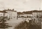 Torget från Hasselbackshuset.

Stämplad i vänstra hörnet: Maria Lundbäck Uddevalla. 1910.