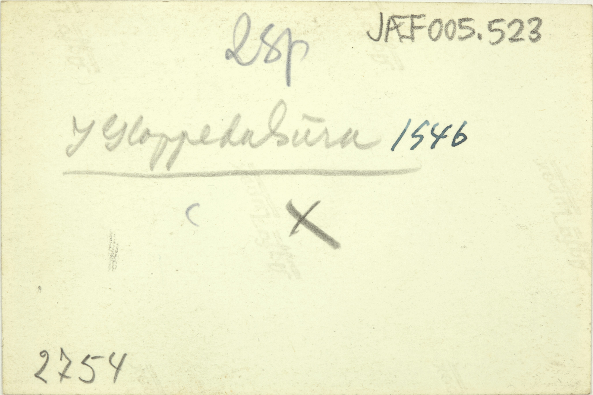 To menn står oppå store steinblokker. På baksida av bildet står det: "I Gloppedalsura 1946"