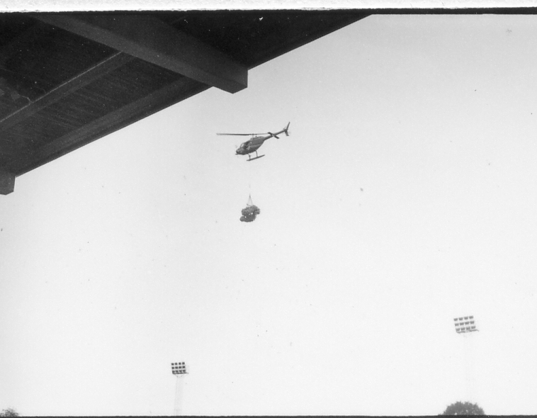 Halmstad, Örjans vall. Prestigederbyt "bäst i stan"- HBK mot Halmia, 18 juli 1984. Foto 1 och 2 (14A-15A) Arla bjöd på gräddtårta. Foto 3, 4 och 5 (16A-18A) Helikopter släppte ner bollar till barnen. Foto 6, 7, 8, 9, 10 (19A-23A) Helikopter släppte ner bollar till barnen. Foto 11 och 12 (24A-25A) Helikopter släppte bollar till barnen. Foto 13, 14 och 15 (26A-28A) Arla luftballong. Foto 16 och 17 (30A-31A) Arla Jet delade ut plastpåsar med reklam.