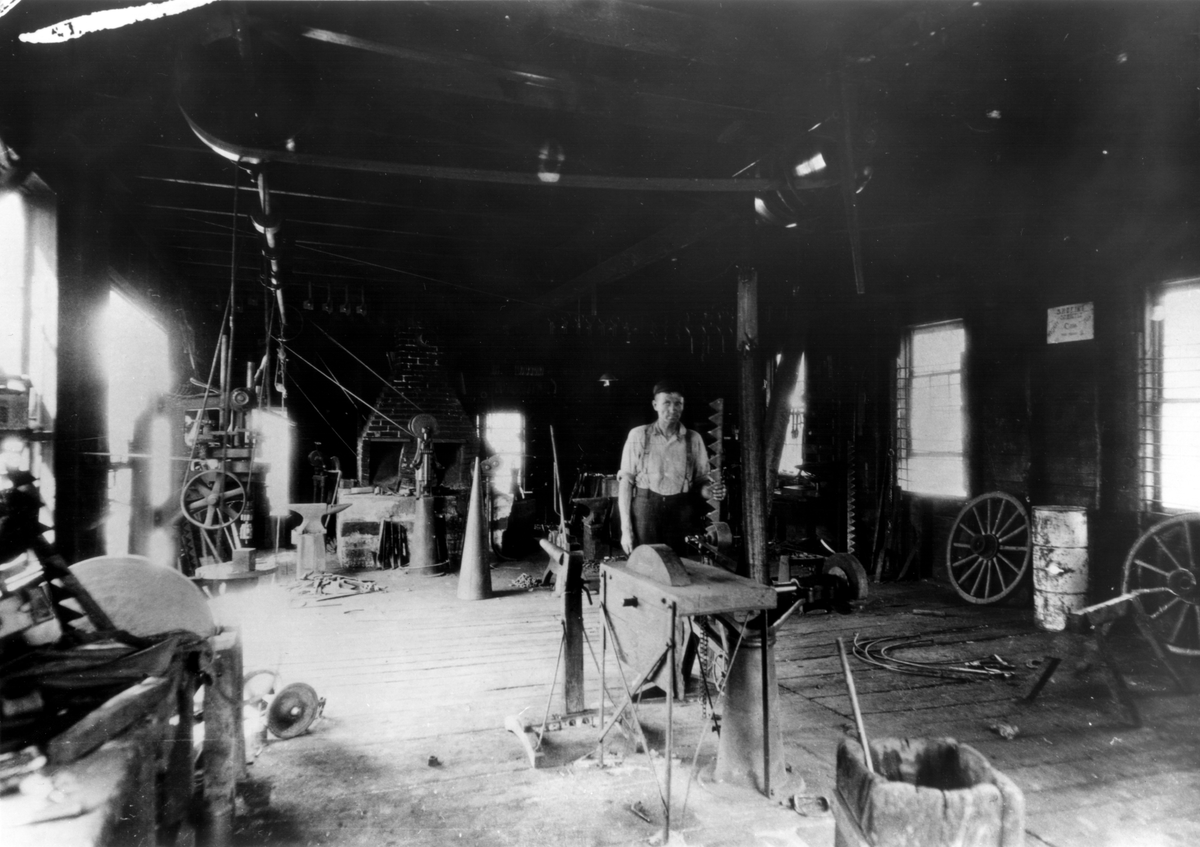 Blacksmith Harry Gunderson in New Richmond, Wisc. 1935.