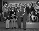 Gunnar Hoffstens orkester. 
På bilden från vänster: Ronald Sjöstrand, Ingemar Wåhlin, Gunnar Hoffsten, Stig-Evert Lampe, Lennart Lillis Andersson, Dag Wasén.
Framför scenen står från vänster: Folke Sahlin, en oidentifierad saxofonist (vi tar gärna emot hjälp med identifiering!) och Hasse Fromholtz.

Fotot är sannolikt taget år 1957. Band. Orkester. Musik.



...

385 bilder om Linköping på 1950-talet från tidningen Östgötens arkiv. Framtidstro och optimism är ord som sammanfattar Linköping på femtiotalet. Årtiondet innebar satsningar för att förbättra linköpingsbornas livsvillkor. Bostadsfrågan och trafiklösningarna dominerade den lokalpolitiska agendan.
Bilderna digitaliserades år 2013.