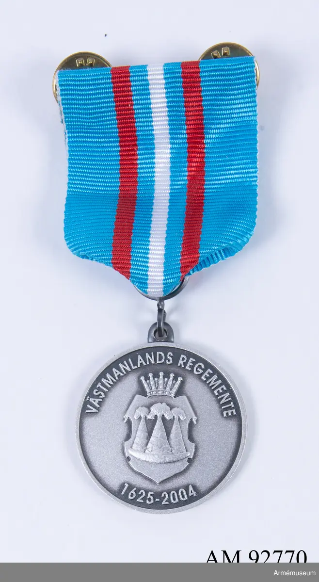 Åtsida: "VÄSTMANLANDS REGEMENTE 1625-2004" Frånsida: Lagerkrans och by Unknown artist