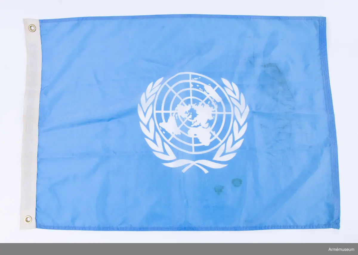 Blå flagga med vit FN-symbol
