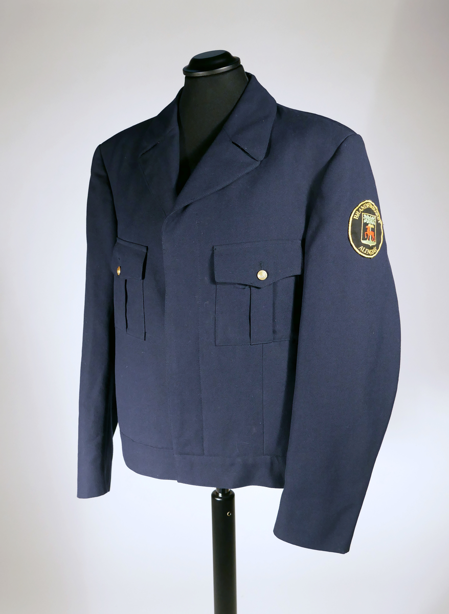 Uniformsjacka från Alingsås brandförsvar. Brukaren var brandförman.
