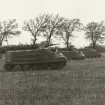 Tre pansarbandvagn pbv 302 i anfall längs fältkant, 1960-tal.