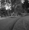 Svenska Flaggans dag 1943. 
En trupp från I 11 tågar in på Värendsvallen.