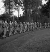 Svenska Flaggans dag 1943. 
En trupp från Hemvärnet (?), tågar in på Värendsvallen.