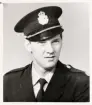 Poliskonstapel Lennart Johansson i uniform, ca 1955. 
Bröstbild, halvprofil. Ateljéfoto.