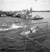 Evedal, 1943. 
Vattenpolomatch. I bakgrunden syns bl a en brygga med mycket publik.