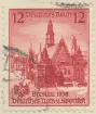 Frimärke ur Gösta Bodmans filatelistiska motivsamling, påbörjad 1950.
Frimärke från Tyskland, 1938. Motiv av Rådhuset i Breslau. 16:de Tyska Idrottsfesten.