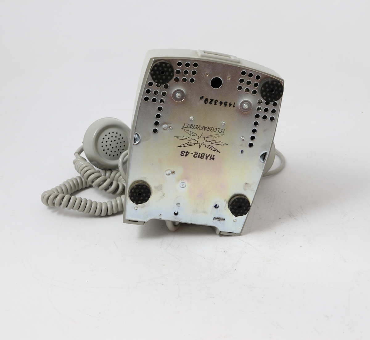Grå bordtelefon med tallskive