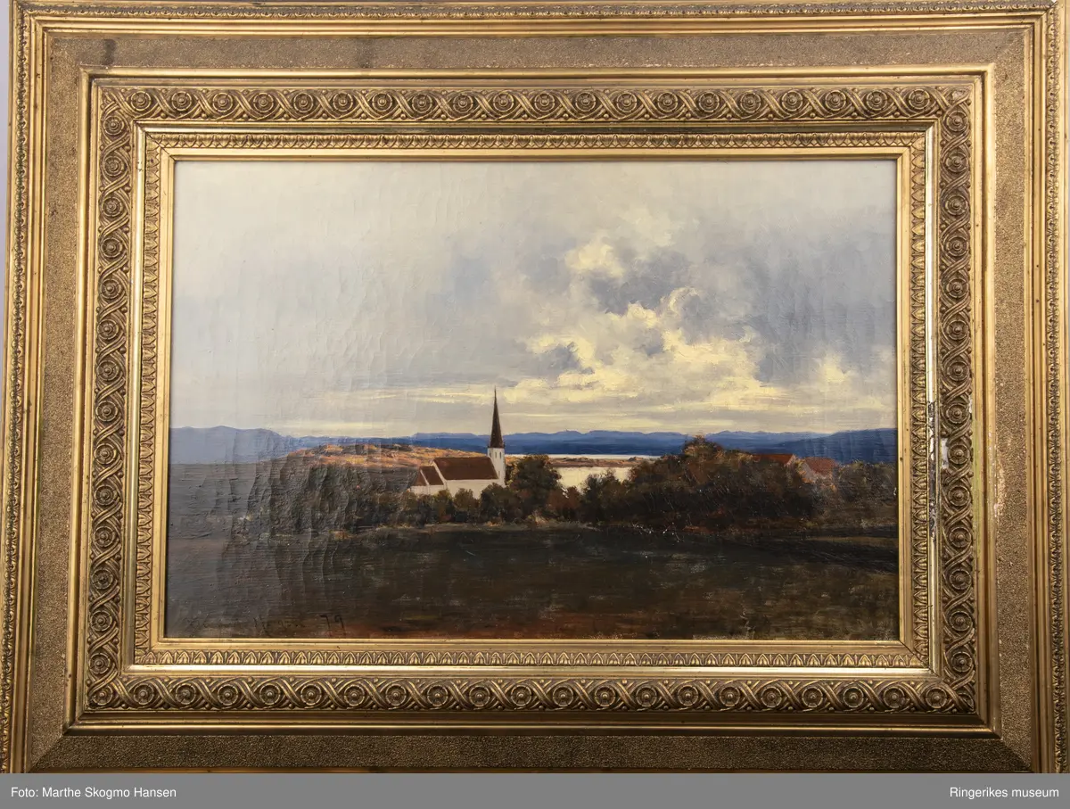 Maleri fra Moe-minnet. Motivet er en kirke i et rolig og flatt landskap. Bildet er signert B  Hygen 79. Hygen er ikke nevnt i firebindsverket Norsk kunstnerleksikon. Maleriet er av ordinær kvalitet. På baksiden av maleriet står det B Hygen Norderhov. Maleriet måler 68 X 53 cm.