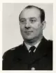 Poliskonstapel Gustaf Kvennewall, Växjö, ca 1955-60.
Bröstbild, halvprofil. Ateljéfoto.